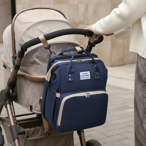 Foldable baby travel bed nappy bag by Noa Nest with stroller attachment and storage pockets  Multi-function diaper backpack Noa Nest with built-in foldable crib for safe baby rest