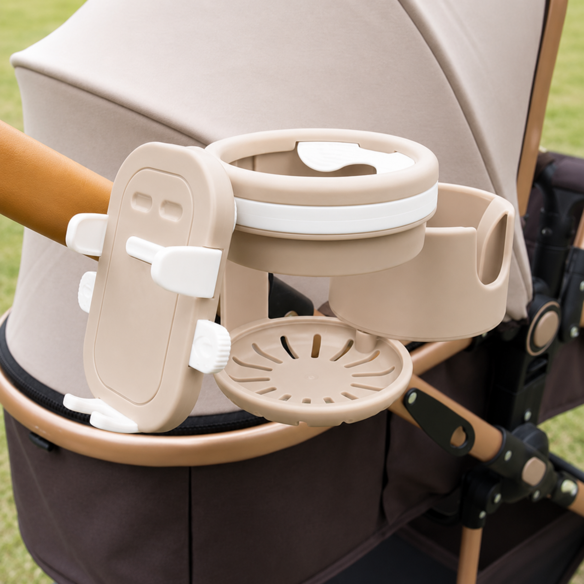 Beige cup holder attached to a stroller handle