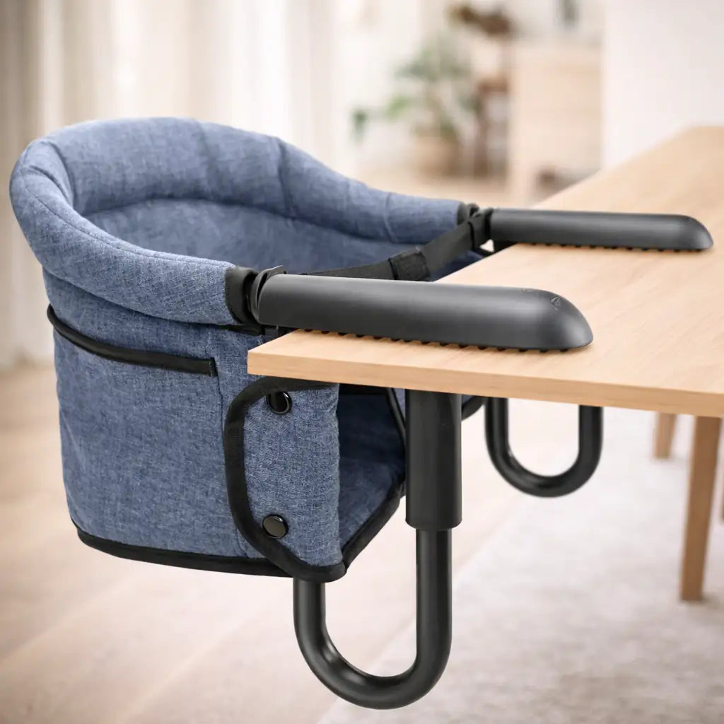 grey clip-on high chair attached securely to a wooden table