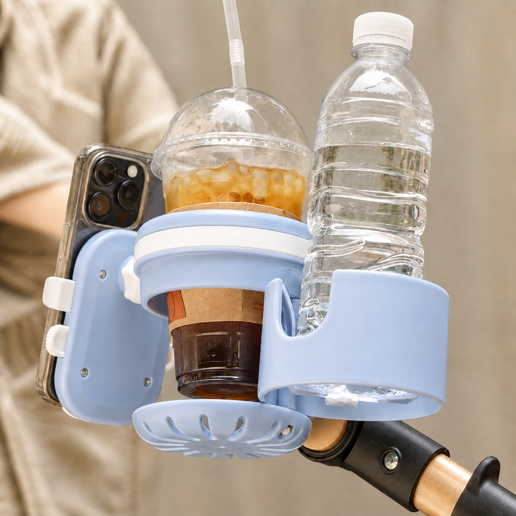 Blue stroller cup holder with phone mount securely attached to a pram handle for convenient drinks and phone storage while out with baby